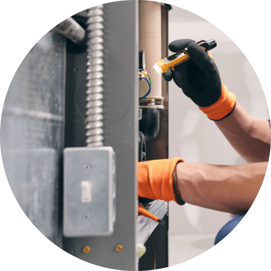 Technician providing heating services in Gardner, KS.